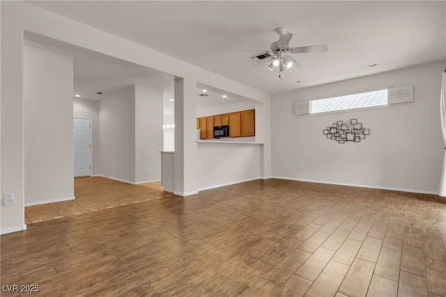 unfurnished living room featuring light wood finished floors, visible vents, baseboards, recessed lighting, and a ceiling fan