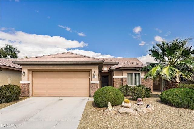 prairie-style house with a garage, stone siding, concrete driveway, and stucco siding