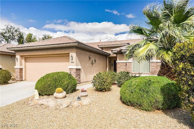 view of front of property featuring a garage, stone siding, concrete driveway, and stucco siding