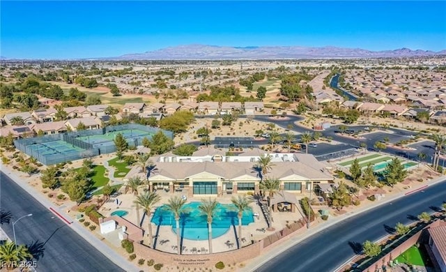 drone / aerial view featuring a residential view and a mountain view