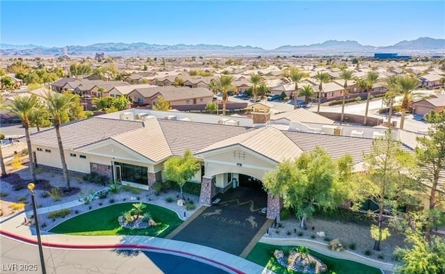 drone / aerial view featuring a residential view and a mountain view