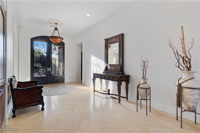 foyer entrance with light tile patterned floors, recessed lighting, and baseboards