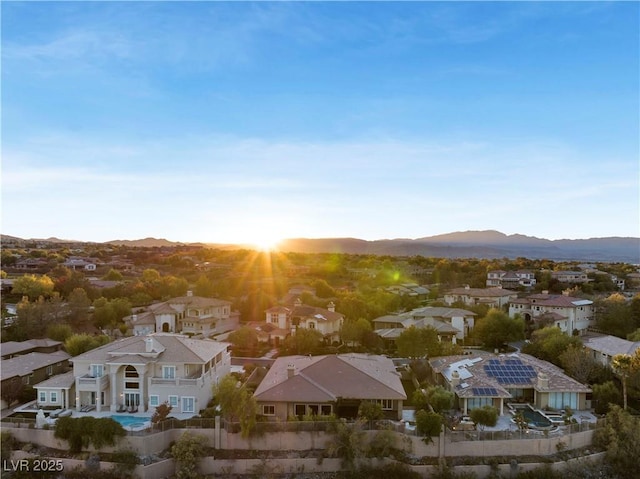 birds eye view of property with a residential view and a mountain view