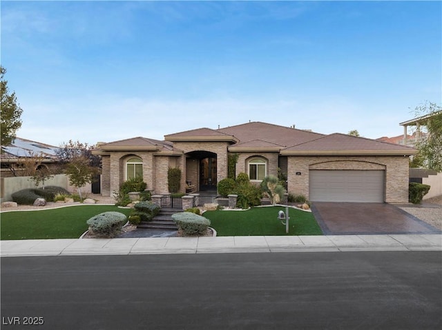 view of front of home with a garage, driveway, a front lawn, and fence