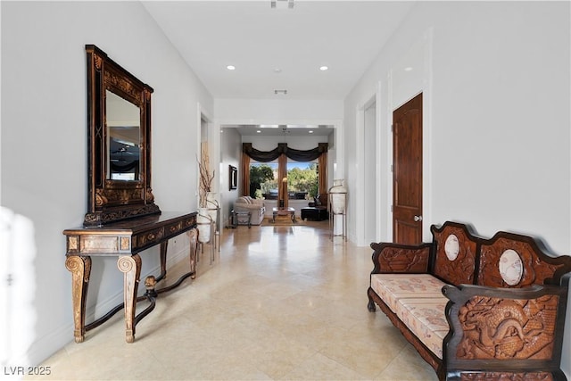 corridor with baseboards and recessed lighting