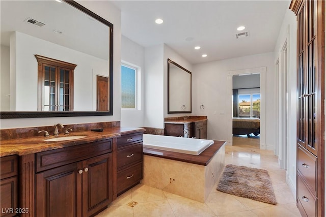 bathroom featuring ensuite bathroom, vanity, visible vents, and recessed lighting