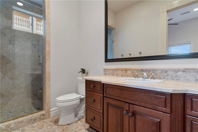 full bath featuring visible vents, a stall shower, vanity, and toilet