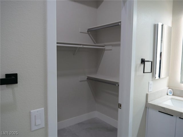 spacious closet with a sink