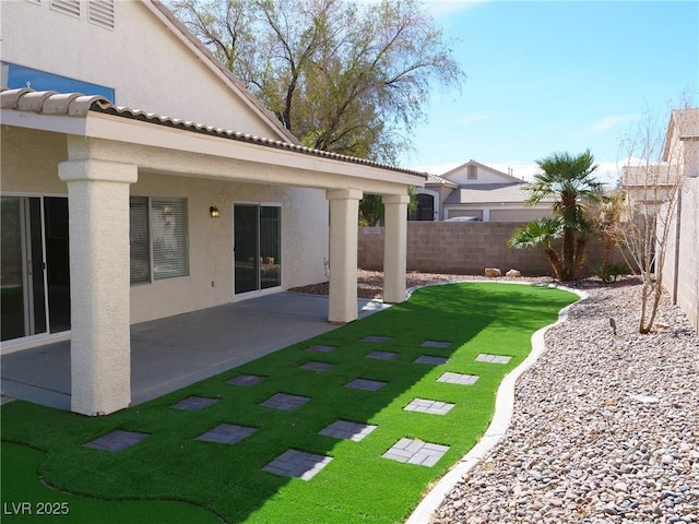 view of yard with fence and a patio