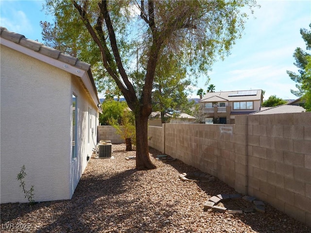 view of yard featuring cooling unit and a fenced backyard