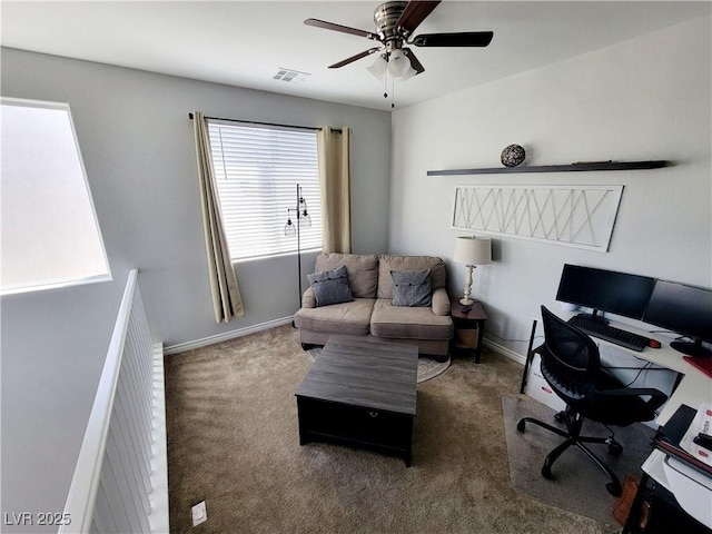 office with carpet, visible vents, ceiling fan, and baseboards