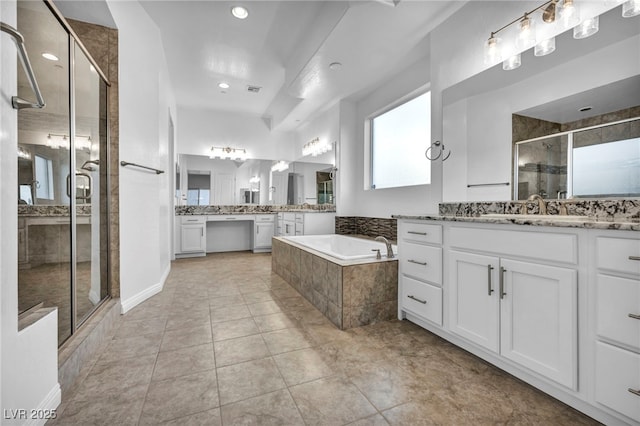 full bath with a sink, two vanities, a shower stall, a bath, and tile patterned floors