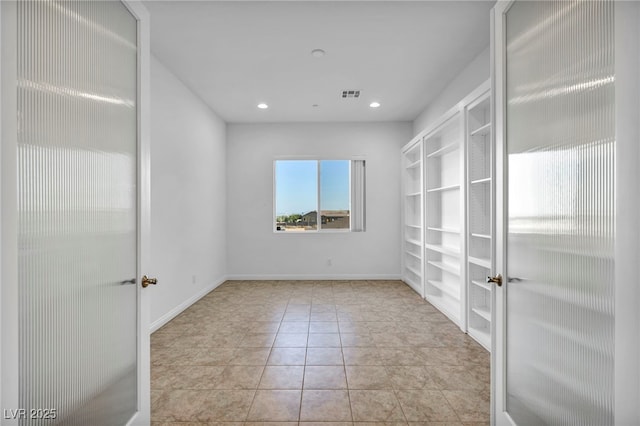 unfurnished room with french doors, light tile patterned floors, recessed lighting, visible vents, and baseboards