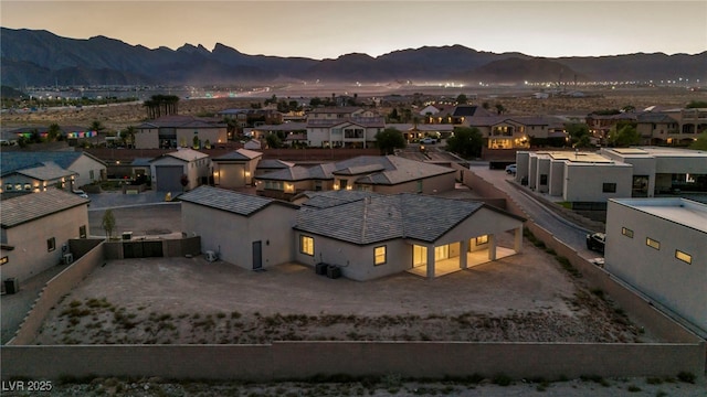 aerial view at dusk with a residential view and a mountain view