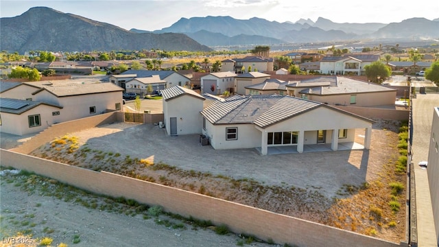 drone / aerial view with a residential view and a mountain view