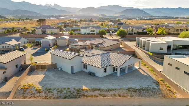 birds eye view of property featuring a mountain view and a residential view