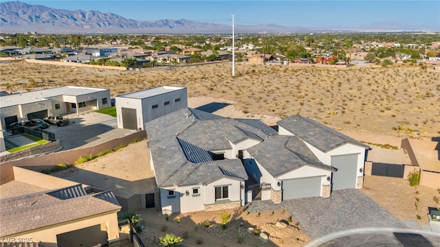 birds eye view of property with a mountain view and a residential view