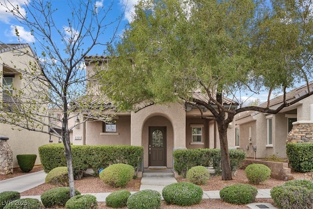 mediterranean / spanish-style home featuring stucco siding