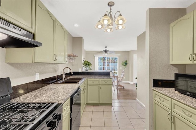 kitchen featuring light tile patterned floors, under cabinet range hood, ceiling fan with notable chandelier, a sink, and black appliances