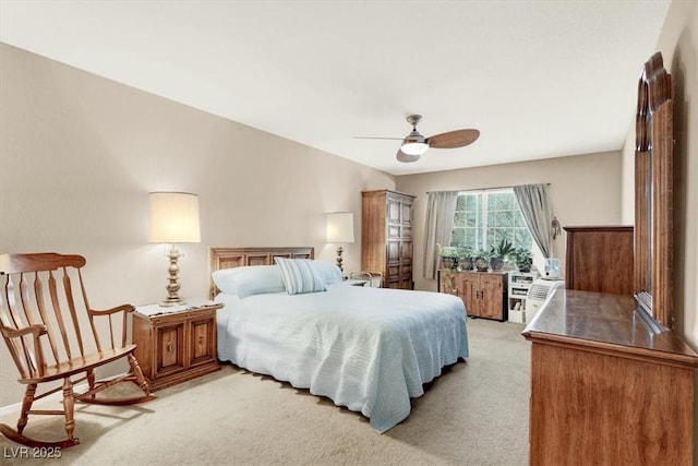 bedroom with light carpet and ceiling fan