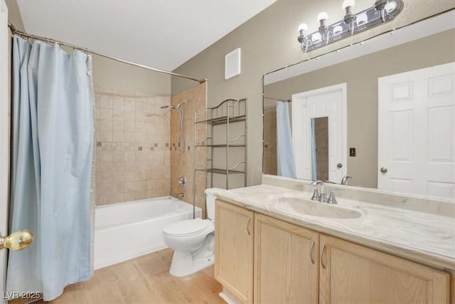 full bath featuring shower / tub combo with curtain, vanity, toilet, and wood finished floors