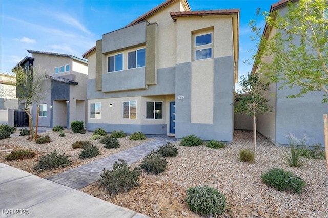 view of front of house featuring stucco siding