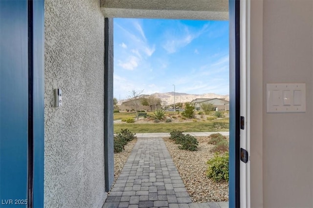 doorway to outside with a mountain view