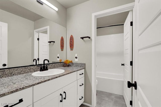 bathroom featuring toilet, shower / bath combination, tile patterned flooring, and vanity