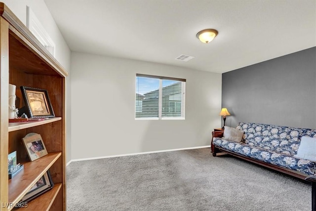 sitting room with carpet, visible vents, and baseboards