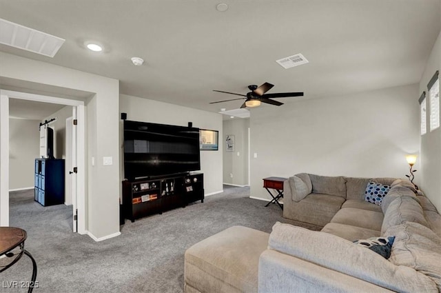 carpeted living area featuring ceiling fan, visible vents, and baseboards