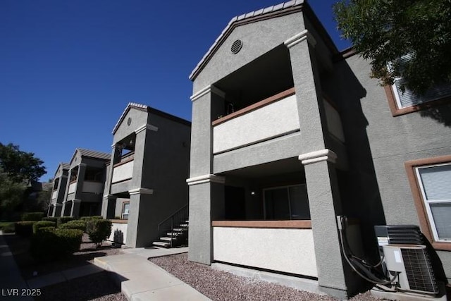 view of property with central AC unit