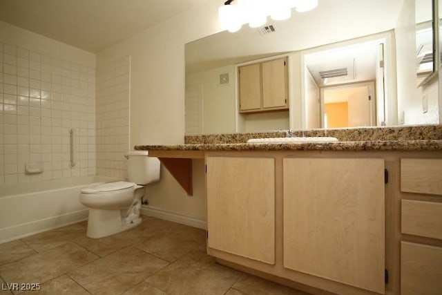 bathroom featuring visible vents, toilet, vanity, tile patterned flooring, and baseboards