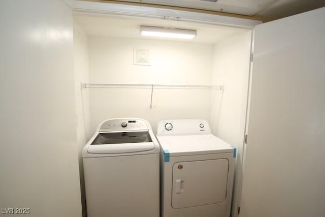 laundry area featuring laundry area and washer and clothes dryer