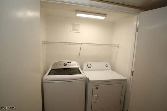 clothes washing area with laundry area and independent washer and dryer