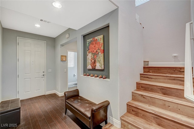 entrance foyer with recessed lighting, dark wood-type flooring, visible vents, baseboards, and stairway