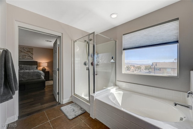 full bathroom featuring a stall shower, ensuite bath, a bath, and tile patterned floors