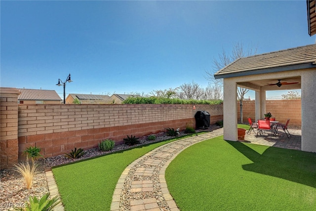 view of yard featuring a patio and a fenced backyard