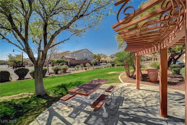 view of patio featuring a residential view and a pergola