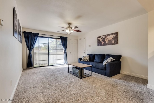 carpeted living room with ceiling fan and baseboards