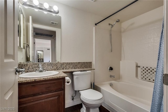 bathroom with toilet, vanity, visible vents, and shower / bathtub combination with curtain