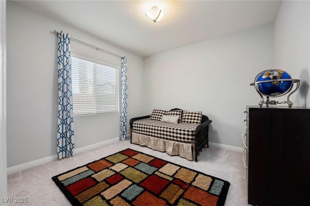 bedroom featuring carpet and baseboards