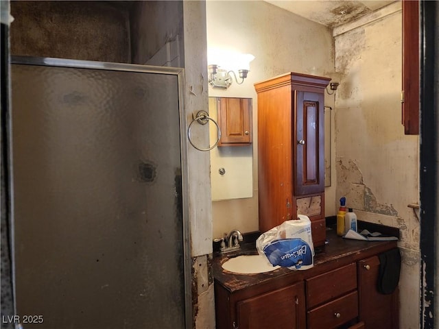 full bath featuring a stall shower and vanity