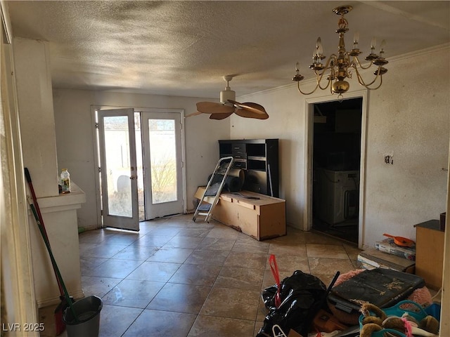 interior space featuring french doors, a textured ceiling, and ceiling fan with notable chandelier