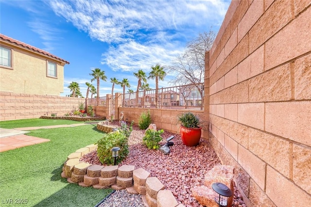 view of yard with a fenced backyard