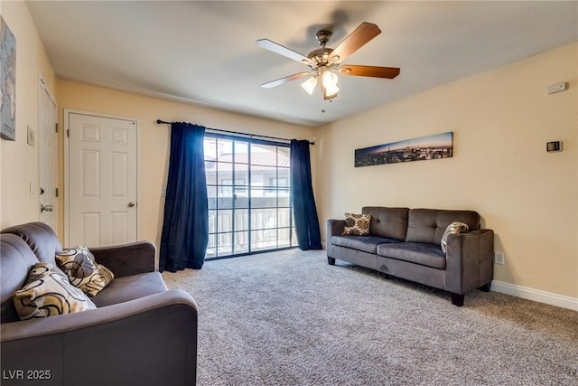 living room with carpet, ceiling fan, and baseboards