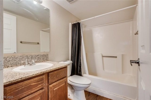 bathroom with toilet, shower / tub combo, wood finished floors, visible vents, and vanity