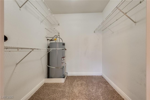 spacious closet with carpet and water heater