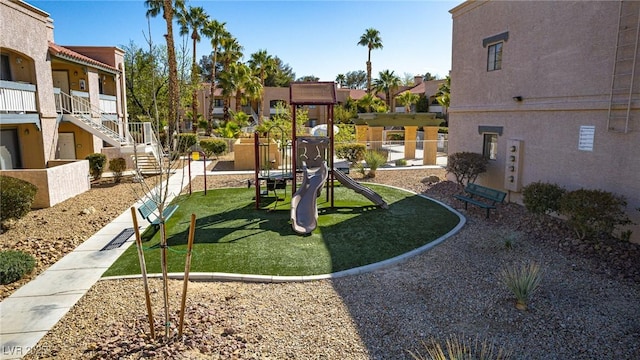 view of community featuring a playground and a residential view