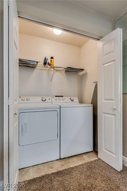 laundry room with washing machine and dryer, laundry area, and light colored carpet