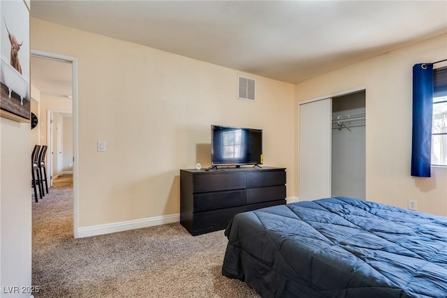 bedroom with carpet, a closet, visible vents, and baseboards